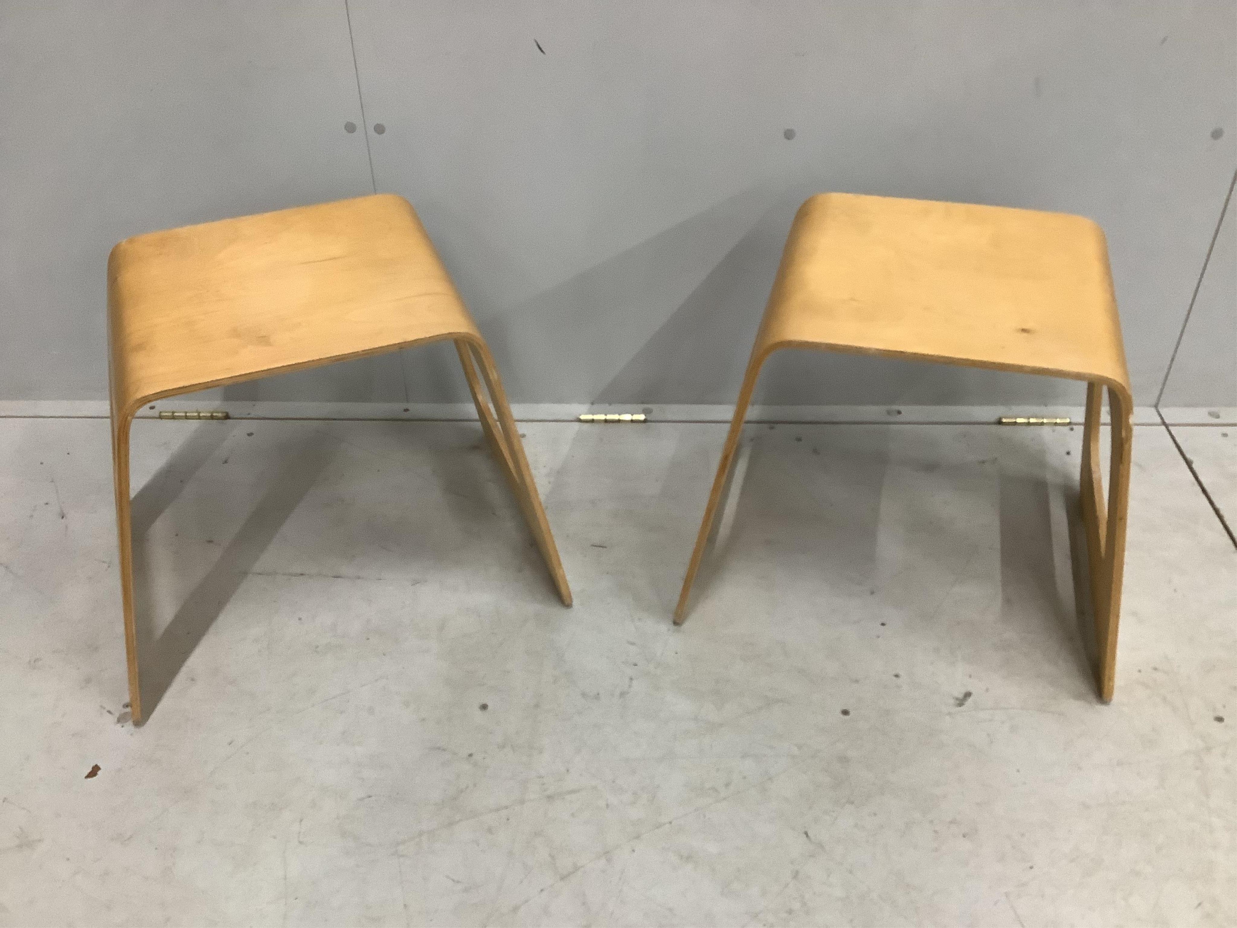 A pair of Swedish wooden stools by USA Norinder for IKEA, c.1990, each width 48cm, depth 35cm, height 44cm. Condition - fair